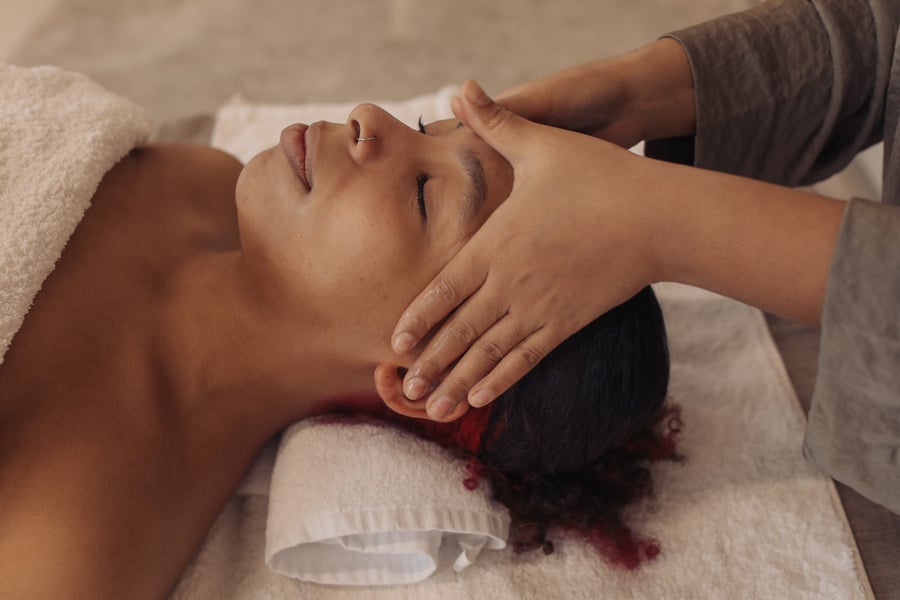 Masseuse Massaging Woman's Face